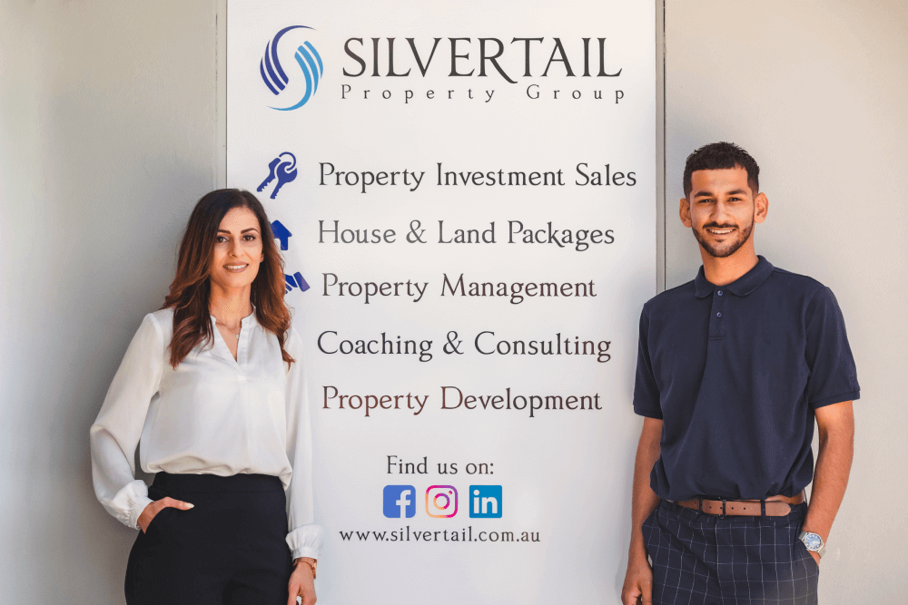 Silvertail Property Managers in front of company signboard